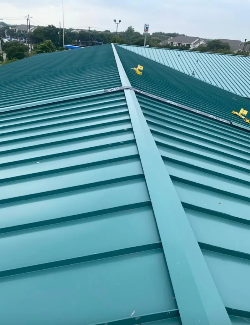 Green commercial metal roof ridge and valley for Metal Roof Repair in South Park