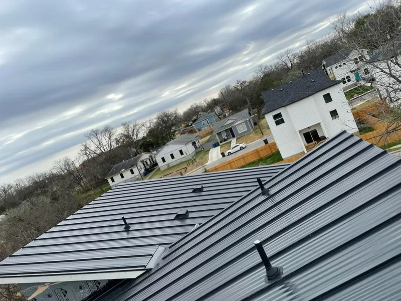 Standing seam metal roof panels with vents for Skylight Repair in South Park